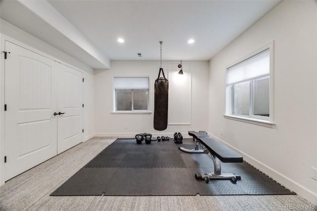 exercise room with recessed lighting, visible vents, and baseboards