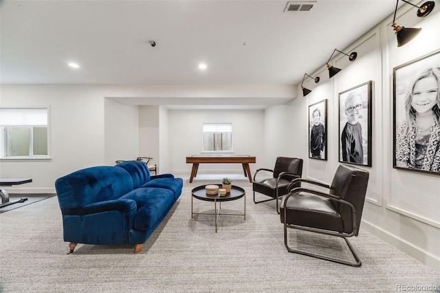 living room featuring baseboards, carpet floors, visible vents, and recessed lighting