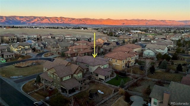 birds eye view of property with a residential view and a mountain view