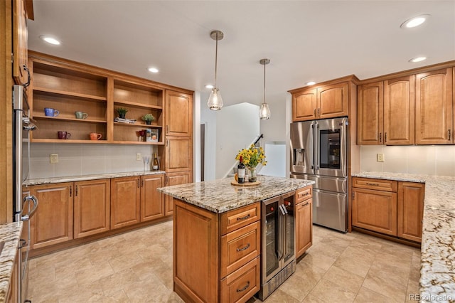 kitchen featuring stainless steel fridge with ice dispenser, pendant lighting, beverage cooler, and light stone counters