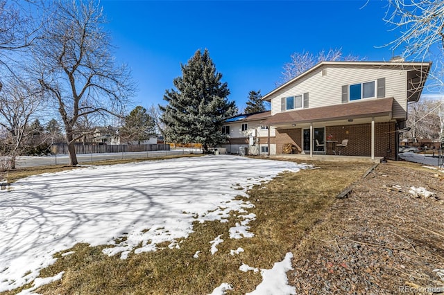 view of snow covered property