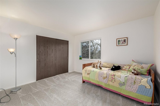 carpeted bedroom featuring a closet