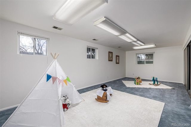 playroom with dark colored carpet