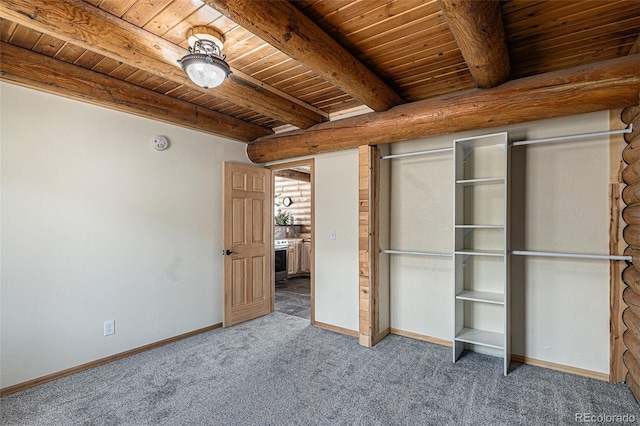 14077 S State Highway 67, Woodland Park, CO 80863 - unfurnished bedroom with wood ceiling, carpet flooring, baseboards, and beam ceiling