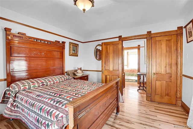 bedroom with light wood finished floors