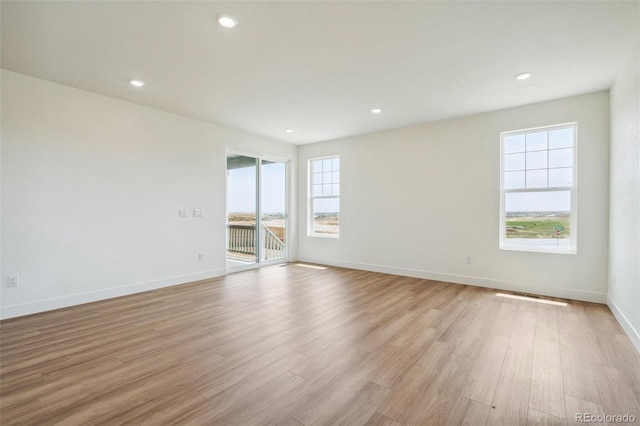 6384 E 154th Pl, Thornton, CO 80602 - empty room with light wood-style flooring, recessed lighting, and baseboards