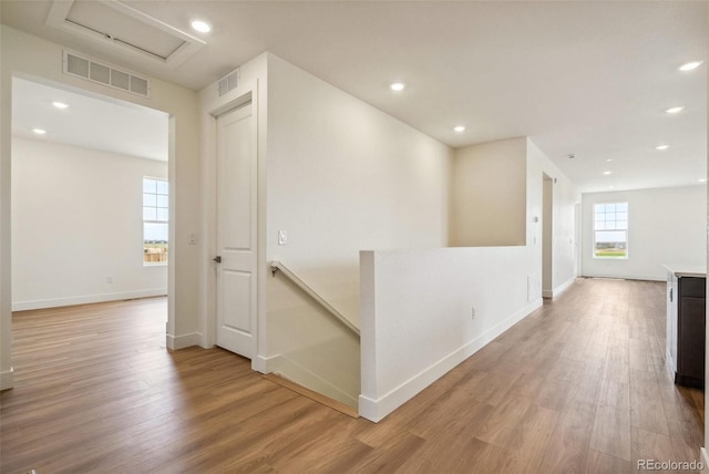6384 E 154th Pl, Thornton, CO 80602 - corridor featuring an upstairs landing, light wood-type flooring, baseboards, recessed lighting, and attic access