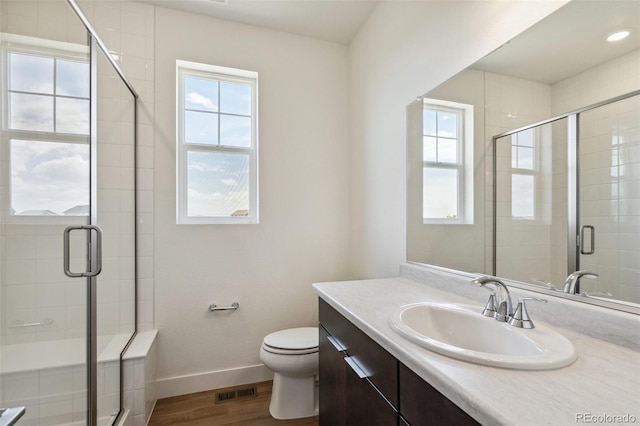 6384 E 154th Pl, Thornton, CO 80602 - full bath with vanity, toilet, wood finished floors, and a shower stall