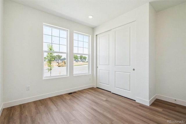 6384 E 154th Pl, Thornton, CO 80602 - unfurnished bedroom featuring baseboards, light wood finished floors, a closet, and recessed lighting