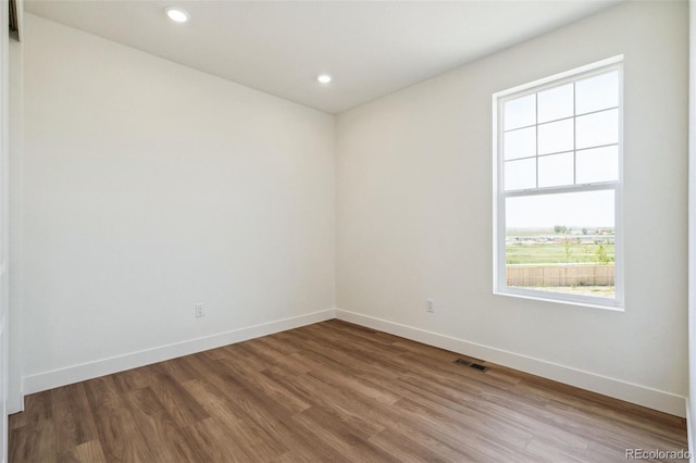 6384 E 154th Pl, Thornton, CO 80602 - empty room with baseboards, wood finished floors, and recessed lighting