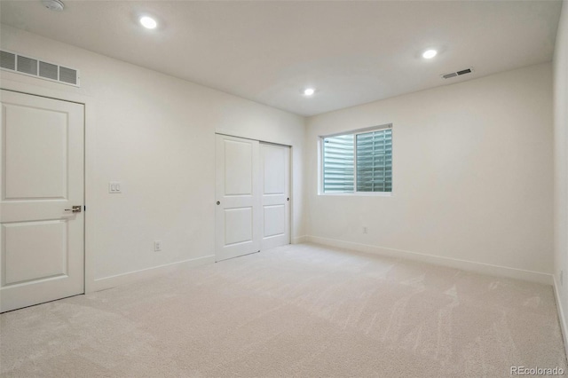 6384 E 154th Pl, Thornton, CO 80602 - unfurnished bedroom with baseboards, light carpet, recessed lighting, and a closet