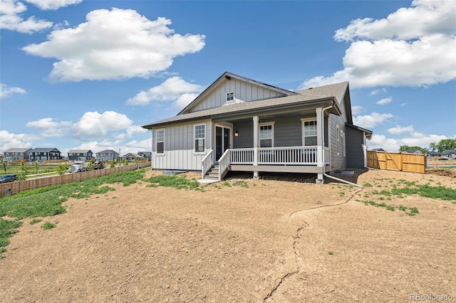 6384 E 154th Pl, Thornton, CO 80602 - view of front facade with board and batten siding and a porch