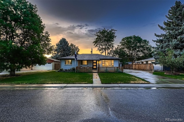 ranch-style home featuring a yard