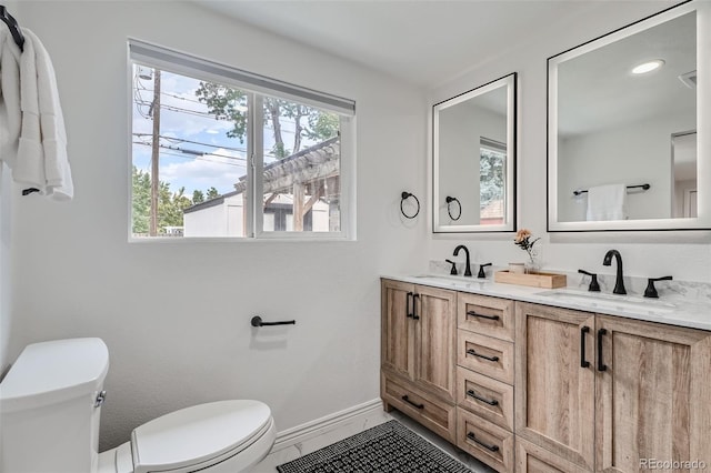 bathroom with vanity and toilet