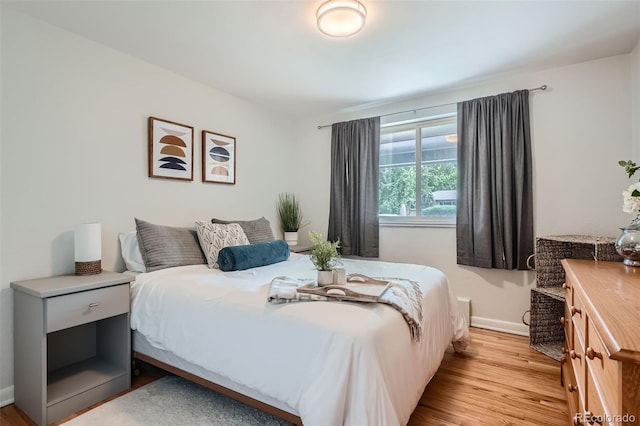 bedroom with light wood-type flooring