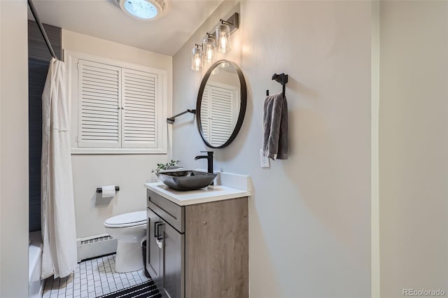 bathroom featuring tile patterned floors, vanity, toilet, and a baseboard heating unit