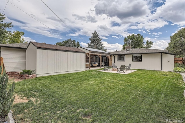 rear view of house featuring a gazebo, a storage unit, a patio area, and a lawn