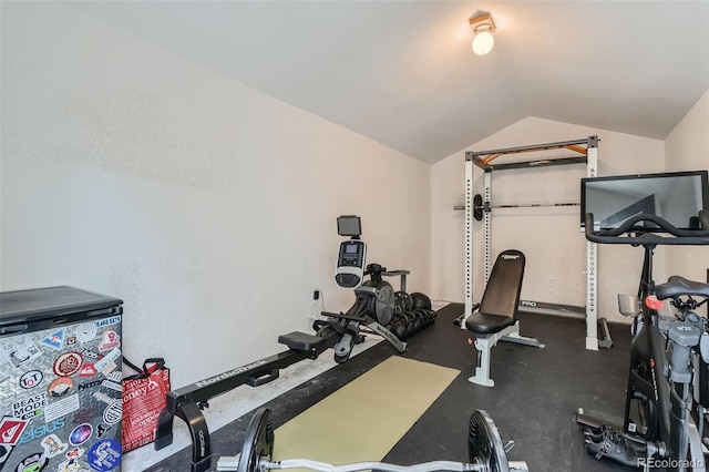 exercise room with vaulted ceiling