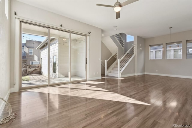 empty room featuring wood-type flooring and ceiling fan