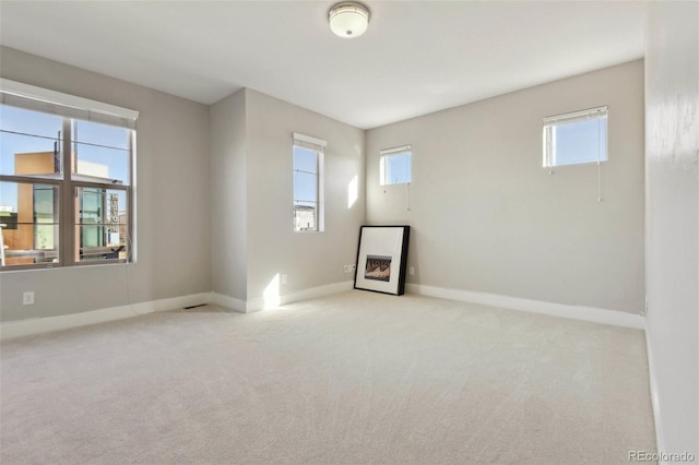 empty room featuring light colored carpet