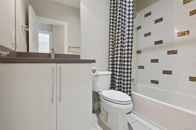 full bathroom featuring tile patterned flooring, vanity, shower / tub combo, and toilet