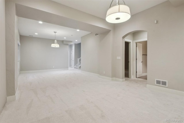 spare room with light colored carpet