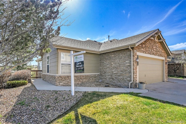 7511 S Sicily Way, Aurora, CO 80016 - view of front of house featuring stone siding, an attached garage, driveway, and roof with shingles