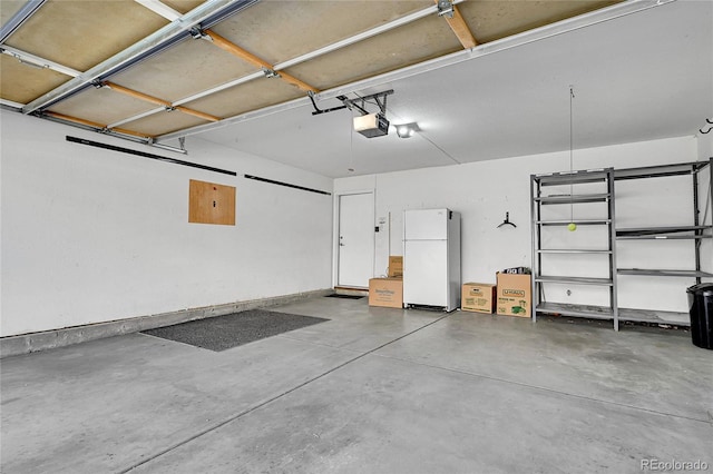 7511 S Sicily Way, Aurora, CO 80016 - garage with freestanding refrigerator and a garage door opener