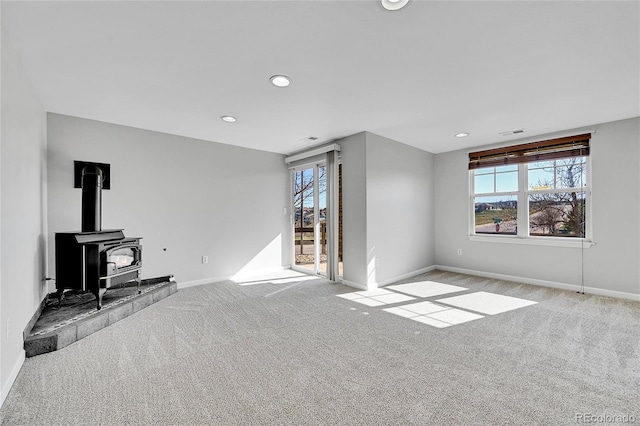 7511 S Sicily Way, Aurora, CO 80016 - unfurnished living room featuring carpet flooring, healthy amount of natural light, baseboards, and recessed lighting
