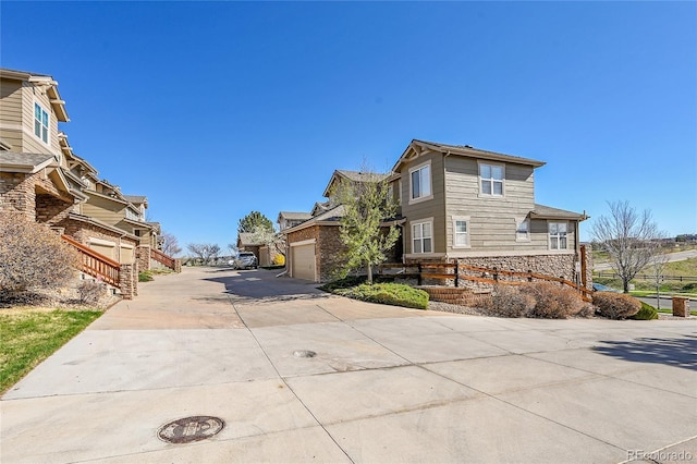 7511 S Sicily Way, Aurora, CO 80016 - view of concrete driveway featuring a residential view