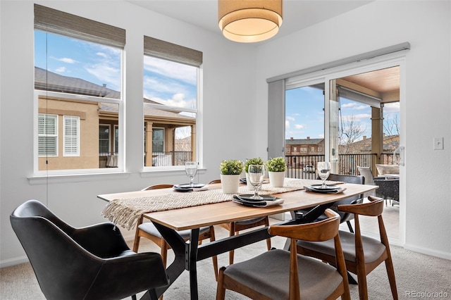 view of carpeted dining area