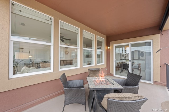 view of patio / terrace with a fire pit