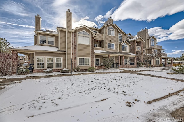 view of snow covered house