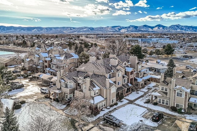 snowy aerial view featuring a mountain view