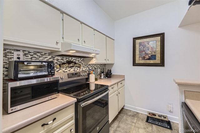 kitchen featuring white cabinets, appliances with stainless steel finishes, and backsplash