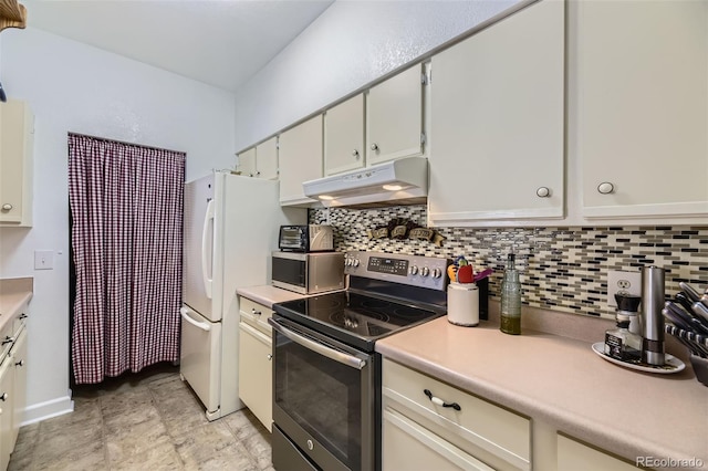 kitchen featuring white cabinets, stainless steel appliances, and tasteful backsplash