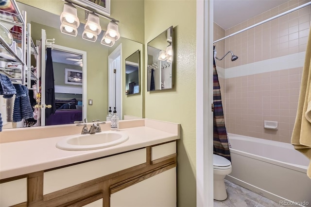 full bathroom with vanity, toilet, and shower / tub combo with curtain