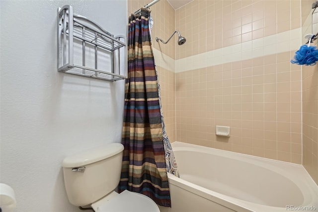 bathroom with shower / bath combo and toilet