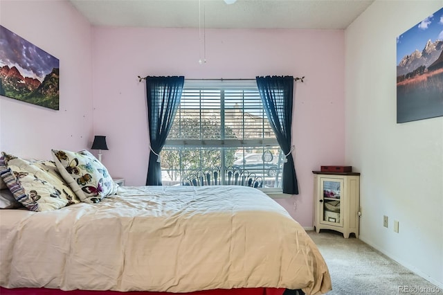 bedroom featuring light carpet