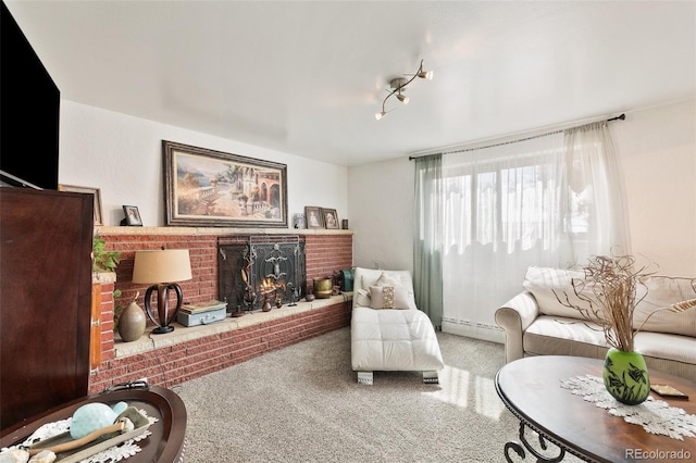 1512 E Monument St, Colorado Springs, CO 80909 - carpeted living room featuring a fireplace and a baseboard heating unit