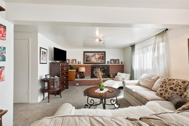 1512 E Monument St, Colorado Springs, CO 80909 - living room featuring carpet floors and a brick fireplace