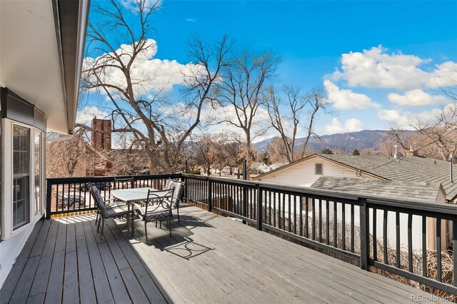 1512 E Monument St, Colorado Springs, CO 80909 - deck with outdoor dining space and a mountain view