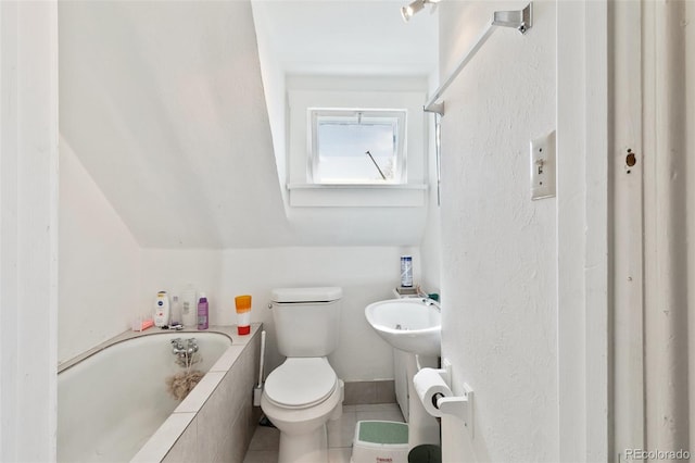 1512 E Monument St, Colorado Springs, CO 80909 - full bathroom with tiled tub, toilet, and tile patterned flooring