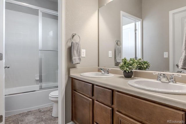 18875 W 93rd Ave, Arvada, CO 80007 - full bathroom featuring double vanity and shower / bath combination with glass door