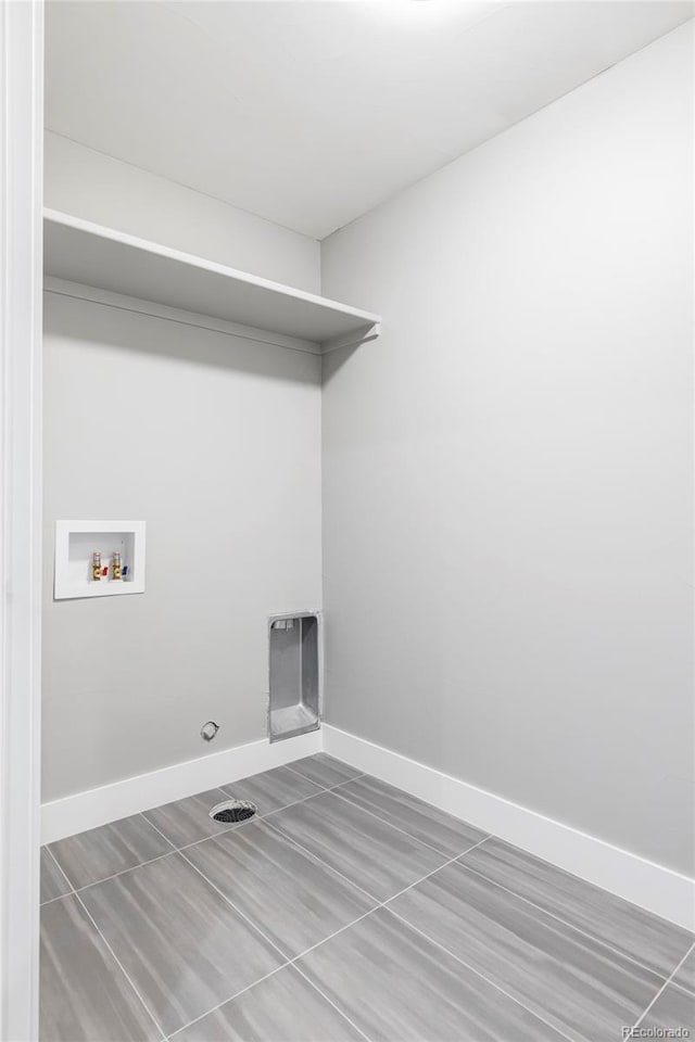 1541 Glencoe St, Denver, CO 80220 - washroom with baseboards and washer hookup