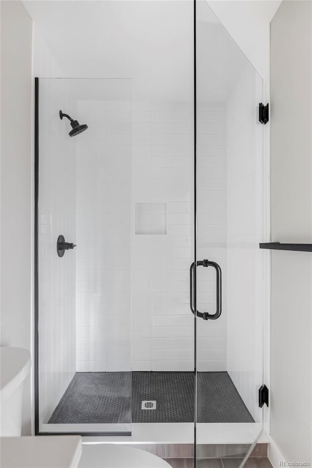 1541 Glencoe St, Denver, CO 80220 - bathroom featuring a shower stall and toilet