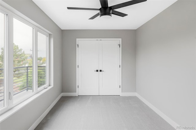 1541 Glencoe St, Denver, CO 80220 - unfurnished bedroom with baseboards, light carpet, a closet, and a ceiling fan