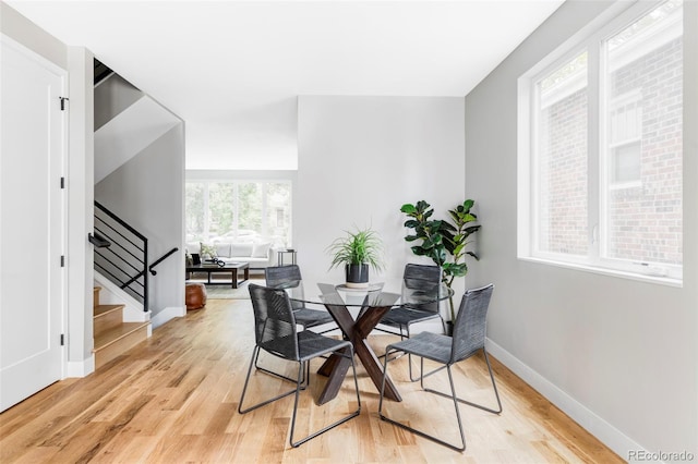 1541 Glencoe St, Denver, CO 80220 - dining area with light wood finished floors, baseboards, and stairs