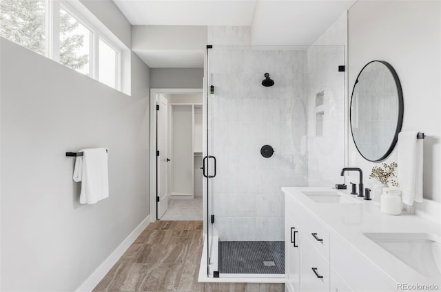 1541 Glencoe St, Denver, CO 80220 - bathroom with double vanity, a stall shower, and baseboards