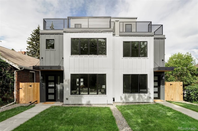 1541 Glencoe St, Denver, CO 80220 - view of front of property with board and batten siding, a gate, and a balcony